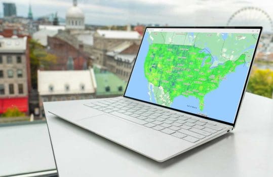 laptop displaying map with imagery overlay
